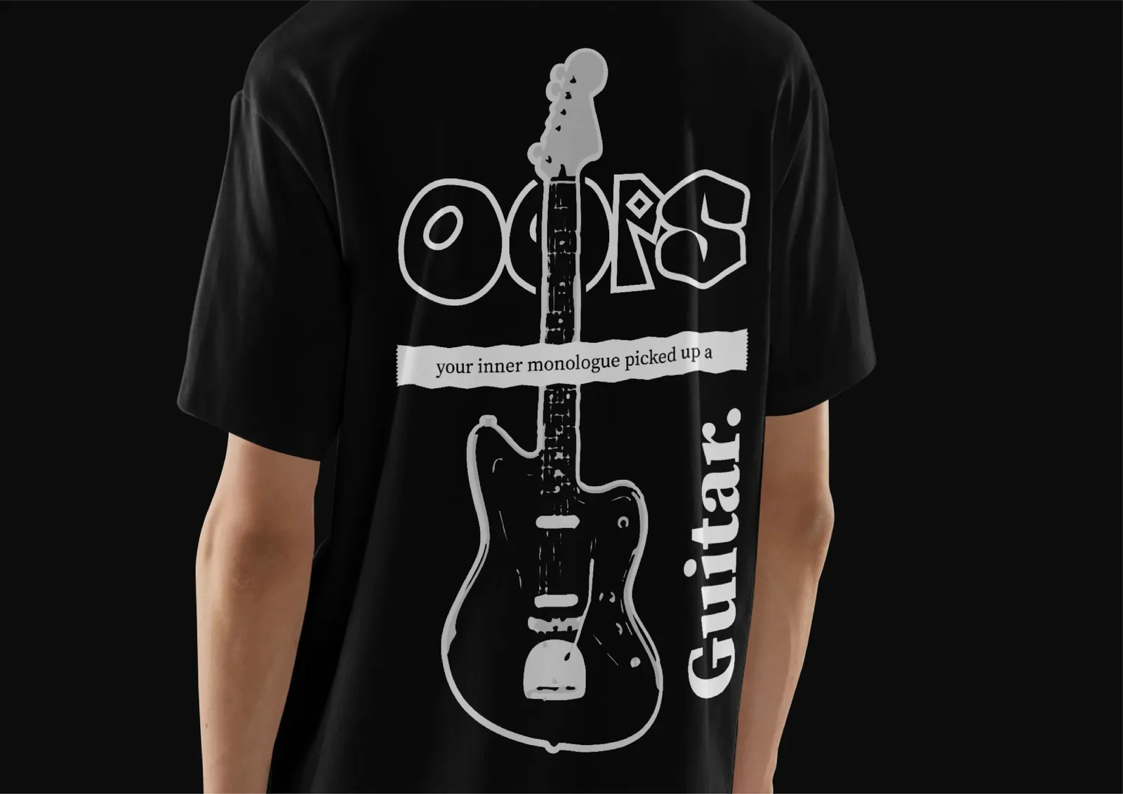 A black T-shirt printed with the “OOPS … Guitar.” artwork.